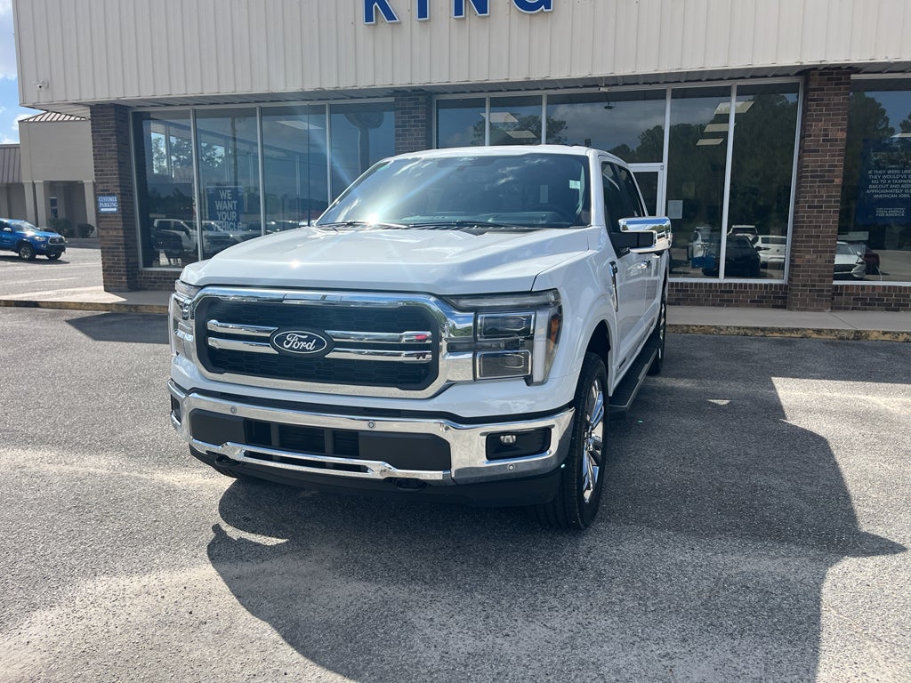 2025 Ford F-150 LARIAT in Oxford White — front three-quarter view
