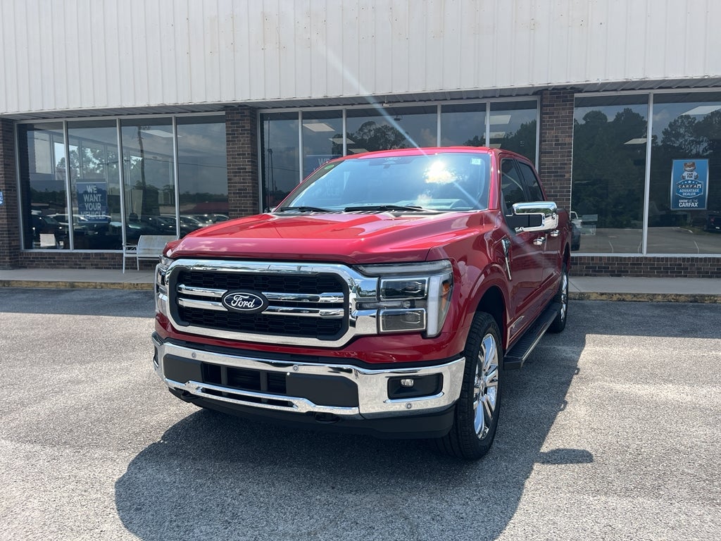 2025 Ford F-150 LARIAT in Rapid Red Metallic Tinted Clearcoat — front three-quarter view